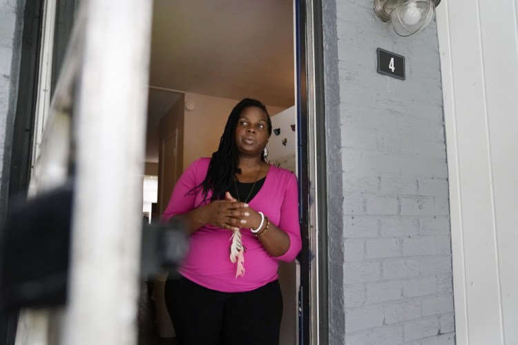 Dylyn Price looks out a doorway from her kitchen at her rented townhome on Tuesday, June 22, 2021, in Athens, Ga. A rental crisis spurred by the pandemic prompted many states to make bold promises to help renters, but most failed to deliver on them after Congress passed the sweeping CARES Act in March 2020. Price said she got about $5,800 in rental assistance but that may not prevent her from losing her home. 