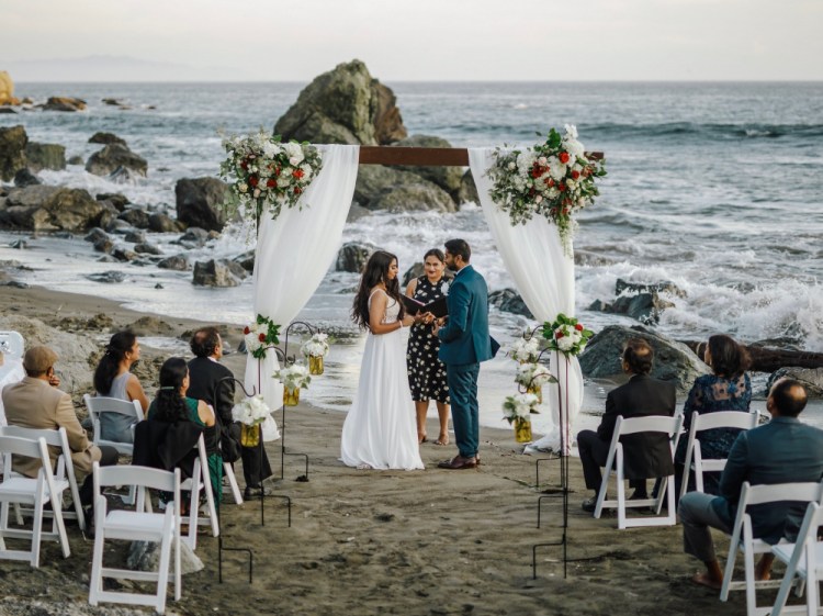 Bride Namisha Balagopal and groom Suhaas Prasad get married in a small ceremony Aug. 15, 2020, on Muir Beach near San Francisco. The couple plans a larger traditional South Asian Indian wedding this August in Utah amid a boom in post-vaccination nuptials around the world.