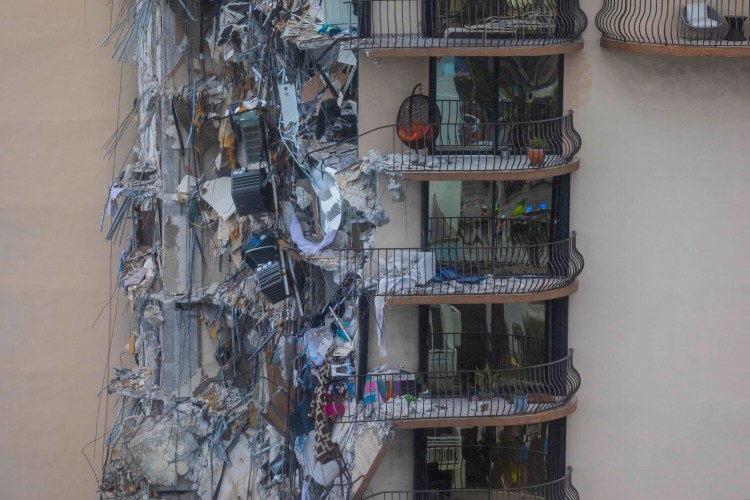 Part of a 12-story condo tower was sheared away in a partial collapse in Surfside, Florida. 