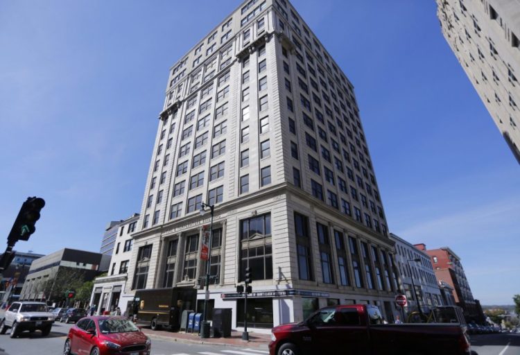 The 14-story Time & Temperature Building at 477 Congress St. could become a luxury hotel with a rooftop bar. 