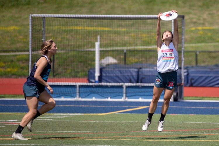 PORTLAND, ME - JULY 10: Yuge Xiao jumps up to catch a pass while scrimmaging with Portland Rising during a training camp at Fitzpatrick Stadium on Saturday July 10, 2021. The team is MaineÕs first professional ultimate frisbee team for women and non-binary athletes. (Staff photo by Brianna Soukup/Staff Photographer)