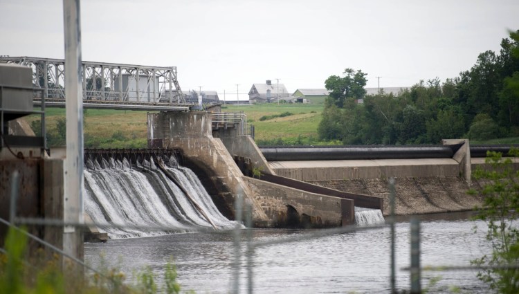 The Shawmut Dam on the Kennebec River in the Shawmut area of Fairfield is seen July 13. Environment groups are suing to force the dam and three others to halt operations during upcoming fish migration periods. 