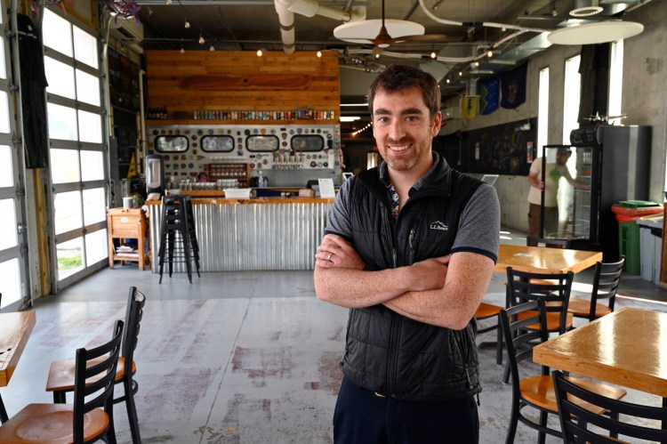 Nate Wildes, owner of Flight Deck and executive director of Live + Work in Maine, at Flight Deck in Brunswick on July 16, 2021. Wildes said many Maine businesses haven't yet determined what their long-term work policies will be after the coronavirus pandemic.