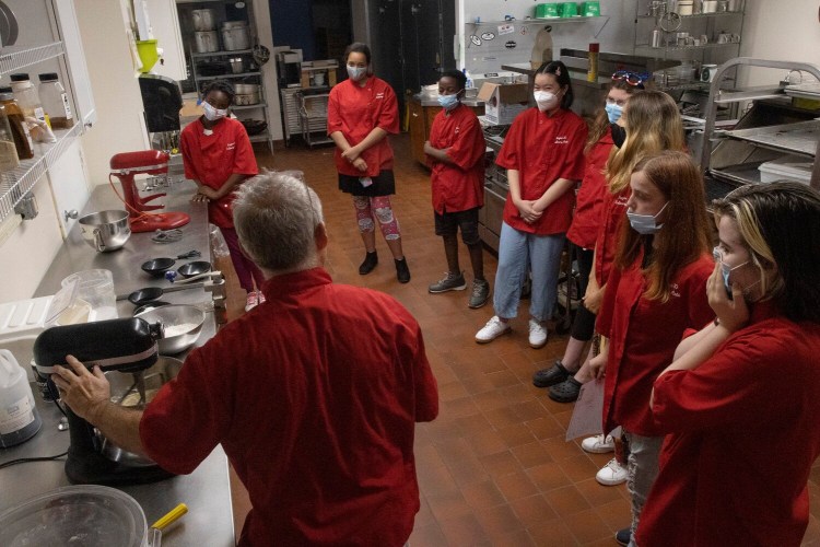 BRUNSWICK, ME - JULY 21: Students watch Culinary Arts instructor Tim Dean as he demonstrates the process of making chocolate chip cookies duirng a career & technical education summer camp at Region 10 Technical High School. (Staff photo by Derek Davis/Staff Photographer)