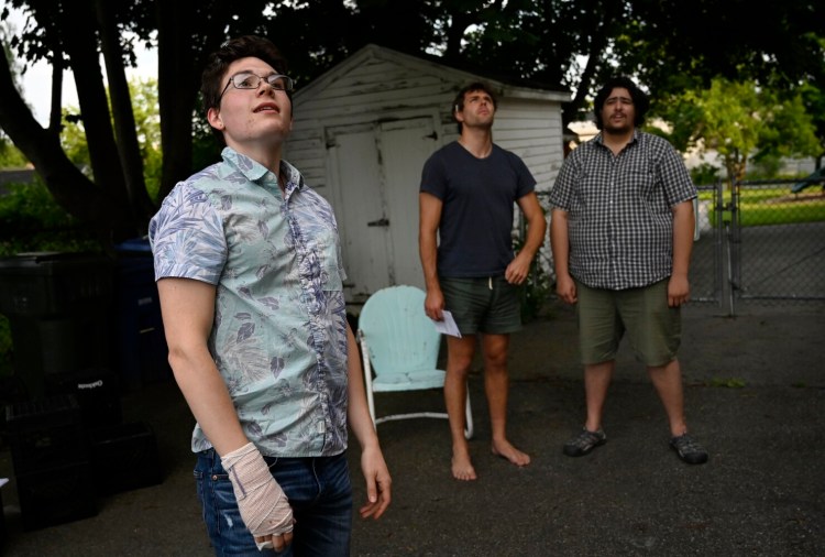 SOUTH PORTLAND, ME - JULY 22: L to R: Parker Hough Dave Register and Sam Rapaport rehearse a scene from "The Alien" outdoors at Mad Horse Theatre in South Portland Thursday, July 22, 2021. The play will be staged outdoors at Tandem Coffee in Portland. (Staff Photo by Shawn Patrick Ouellette/Staff Photographer)