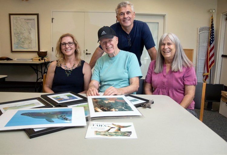 SCARBOROUGH, ME - JULY 22: Illustrator Michael David Brown, seated, and other members of the Scarborough Public Library Sketching Group, Debra LaPlante, left,, Pat Scammon, and John Girard. The artists will be exhibiting and selling their works at an event the library is hosting Saturday. (Staff photo by Derek Davis/Staff Photographer)
