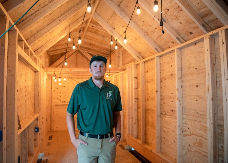 Jonah Crowell of Auburn became interested in building a tiny house after watching TV shows about them. When his girlfriend told him she had always wanted to live in a tiny house, he was determined to build one, learning about the process as he built it.