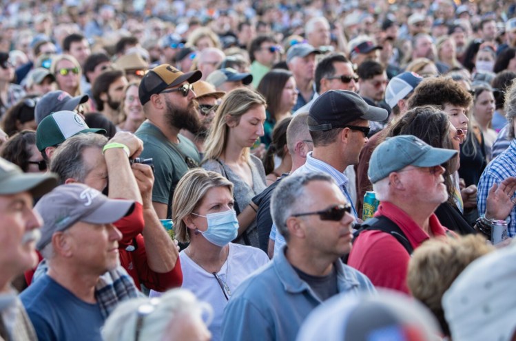 PORTLAND, ME: JULY 30: One mask among many without, people take in live music performance in large groups once again at Thompson’s Point in Portland on Friday, July 30, 2021(Photo by Carl D. Walsh/Staff Photographer)