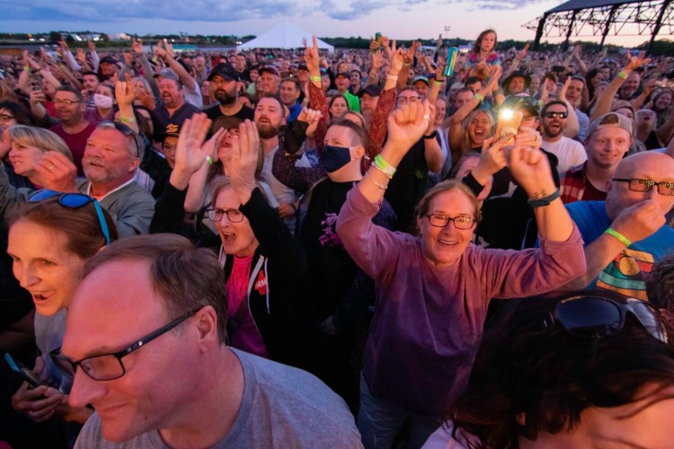 Concertgoers cheer for Nathaniel Rateliff and the Night Sweats at Thompson's Point in Portland in July. 