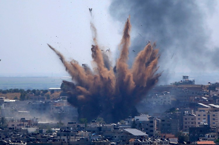 Smoke rises following Israeli airstrikes on a building in Gaza City on May 13. Human Rights Watch on Tuesday accused the Israeli military of carrying attacks that "apparently amount to war crimes" during the 11-day war. 