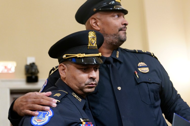 U.S. Capitol Police Sgt. Aquilino Gonell left, and U.S. Capitol Police Sgt. Harry Dunn stand after the House select committee hearing on the Jan. 6 attack on Capitol Hill in Washington, Tuesday, July 27, 2021. (AP Photo/ Andrew Harnik, Pool)