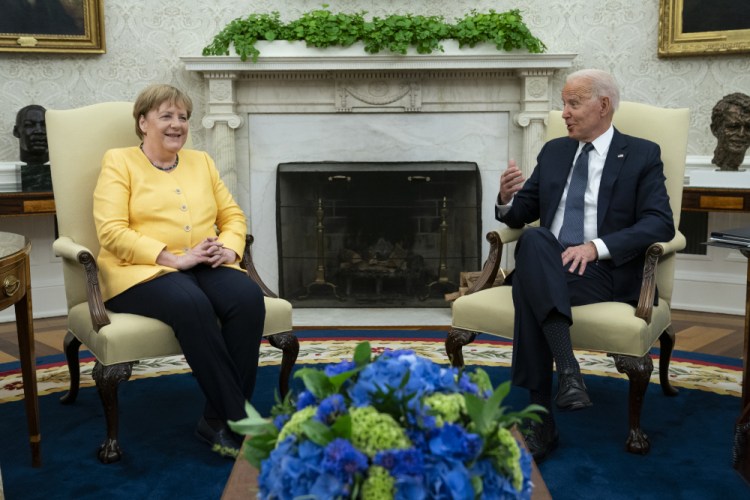 President Biden meets with German Chancellor Angela Merkel in the Oval Office of the White House on Thursday in Washington.