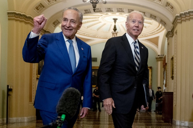 President Biden joins Senate Majority Leader Chuck Schumer, D-N.Y., and fellow Democrats at the Capitol in Washington on Wednesday to discuss the latest progress on his infrastructure agenda. 