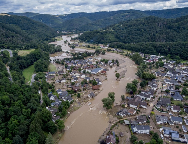 The Ahr river floats past destroyed houses in Insul, Germany on Thursday.