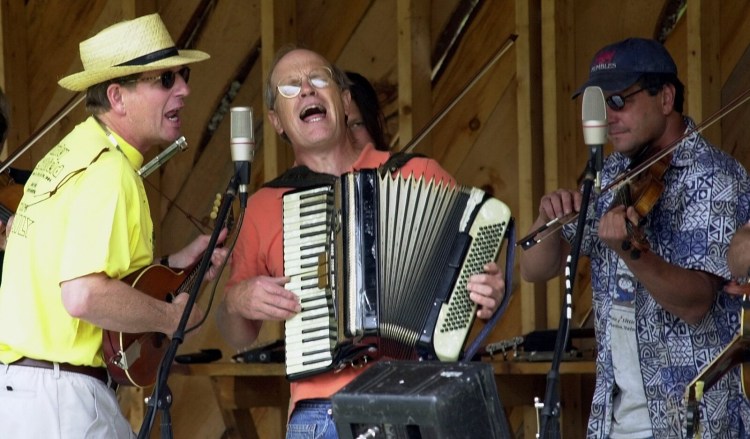 Staff photo / DAVID LEAMING
John Bunker sings while playing the accordian with other members of the East Benton Jug Band durng the East Benton Fiddlers Contest on Sunday.