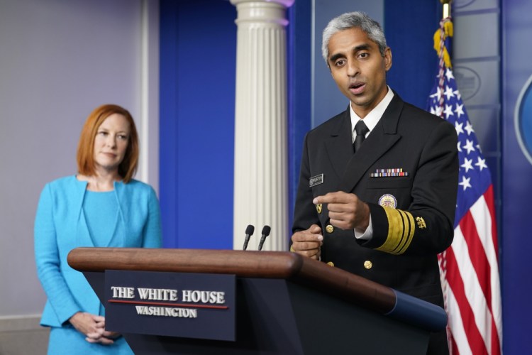 Surgeon General Dr. Vivek Murthy speaks during the daily briefing at the White House in Washington on Thursday. White House press secretary Jen Psaki is at left. 