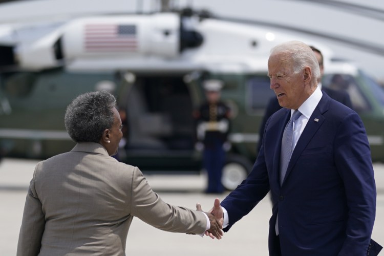 President Joe Biden greets Chicago Mayor Lori Lightfoot, as he arrives at O'Hare International Airport, Wednesday, July 7, 2021, in Chicago. 