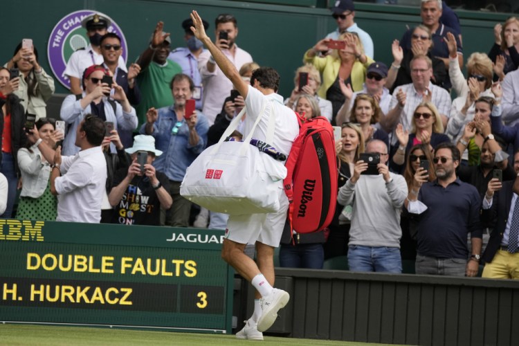 Switzerland's Roger Federer leaves the court after being defeated by Poland's Hubert Hurkacz at Wimbledon.
