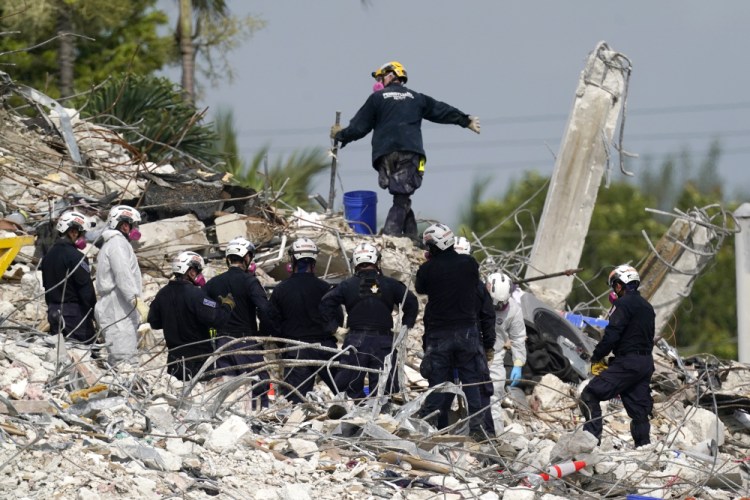 Rescue crews work at the site of the collapsed Champlain Towers South condo building after the remaining structure was demolished Sunday, in Surfside, Fla., Monday, July 5. 
