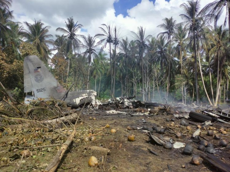 The remains of a Philippine military C-130 plane that crashed in Patikul town, Sulu province, southern Philippines on Sunday.