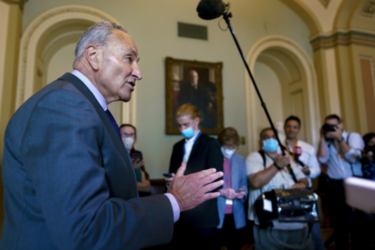 Senate Majority Leader Chuck Schumer, D-N.Y., updates reporters on the infrastructure negotiations between Republicans and Democrats, at the Capitol in Washington on Wednesday.

