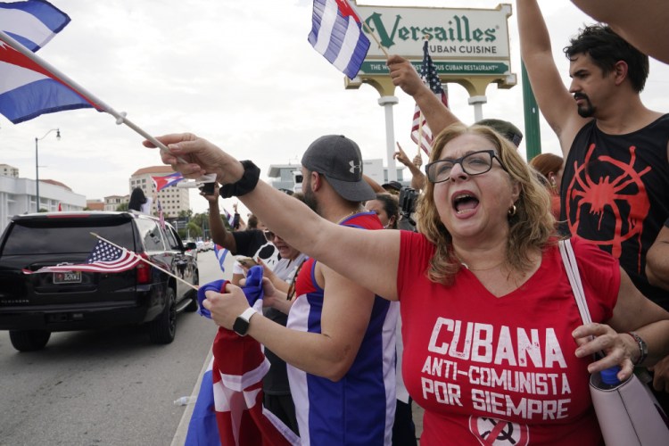 Cuban exiles rally at Versailles Restaurant in Miami's Little Havana neighborhood in support of protesters in Cuba, Monday, July 12, in Miami. Sunday's protests in Cuba marked some of the biggest displays of antigovernment sentiment in the tightly controlled country in years. 