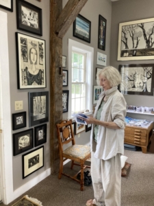 Deirdre Cavanagh, surrounded by her artwork