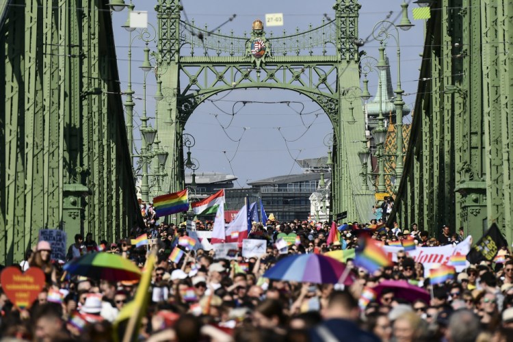 LGBT activists and supporters march across the Szabadsag, or Freedom Bridge, over the river Danube in downtown Budapest during a gay pride parade on Saturday.