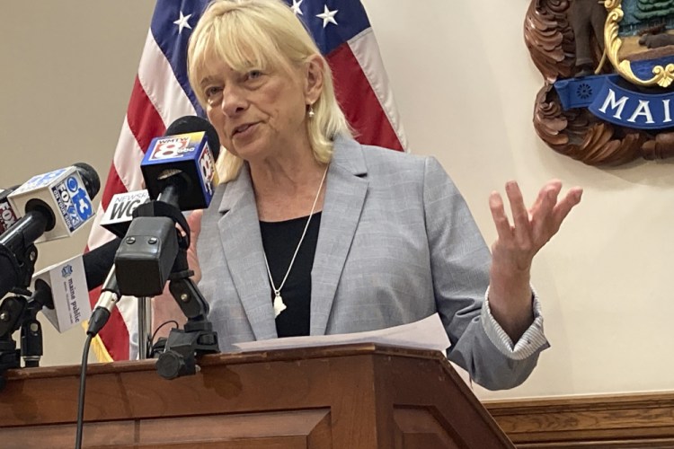 Maine Gov. Janet Mills speaks to reporters in her Cabinet room on Tuesday in Augusta  after announcing she has vetoed a bill to replace the state's privately owned electric utilities with a consumer-owned utility. 