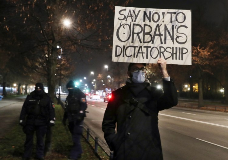 A man protests the policies of Hungarian Prime Minister Viktor Orban during Orban's talks with Poland's Prime Minister Mateusz Morawiecki on Nov. 30 in Warsaw, Poland.