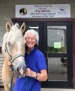 RTT Volunteer Pat Niboli, pictured with therapy horse Flynn, Selected for International Award 