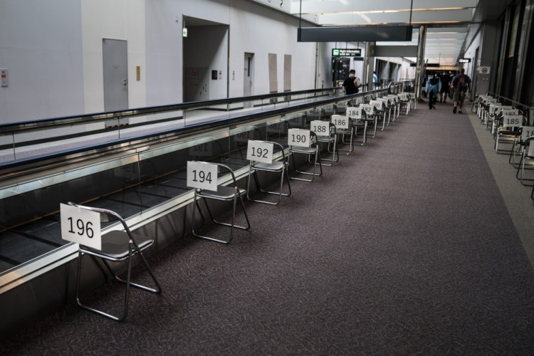 Chairs are numbered in the holding area for foreign visitors at the Narita International Airport on July 10 near Tokyo. 

