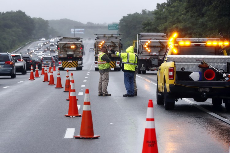 Traffic on Interstate 95 is diverted in the area of an hours long standoff with a group of armed men that partially shut down the highway, Saturday in Wakefield, Mass.