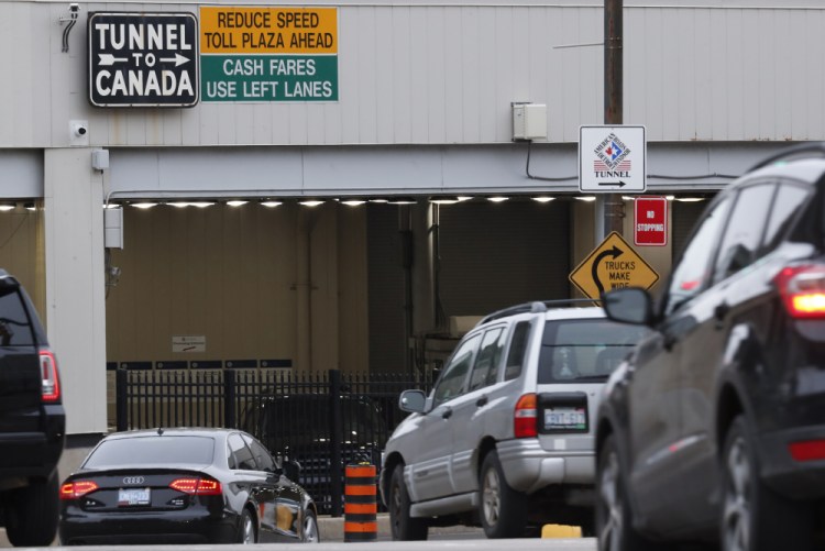 Vehicles enter the Detroit-Windsor Tunnel in Detroit to travel to Canada in March 2020.  