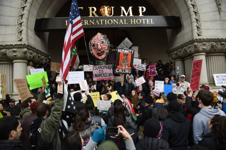 Protesters rally Jan. 29, 2017, at the Trump hotel in Washington, D.C., against President Trump's executive order to bar all refugees and Muslims from seven mostly Muslim countries. MUST CREDIT: Photo for The Washington Post by Bloomberg photo by Astrid Riecken