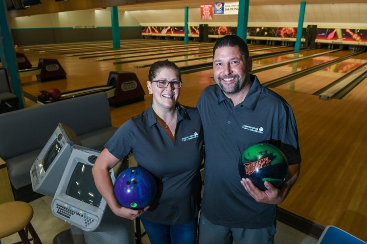 New owners Samantha and Justin Juray stand Tuesday in the former Sparetime Recreation bowling center in Lewiston. The bowling alley is reopening Wednesday as Just-In-Time Recreation.