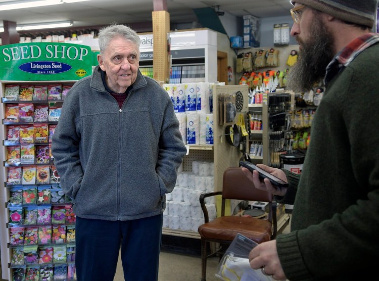 GARDINER, ME - MARCH 18: Bill Harvey, the proprietor of Harvey's Hardware, left, speaks Monday March 18, 2019 with carpenter Abraham Cates at the store in Gardiner. Preliminary work has commenced on the construction project by the Maine Department of Transportation on replacing two bridges crossing Cobbossee Stream in Gardiner, which adjoin Harvey's business.Staff photo by Andy Molloy
