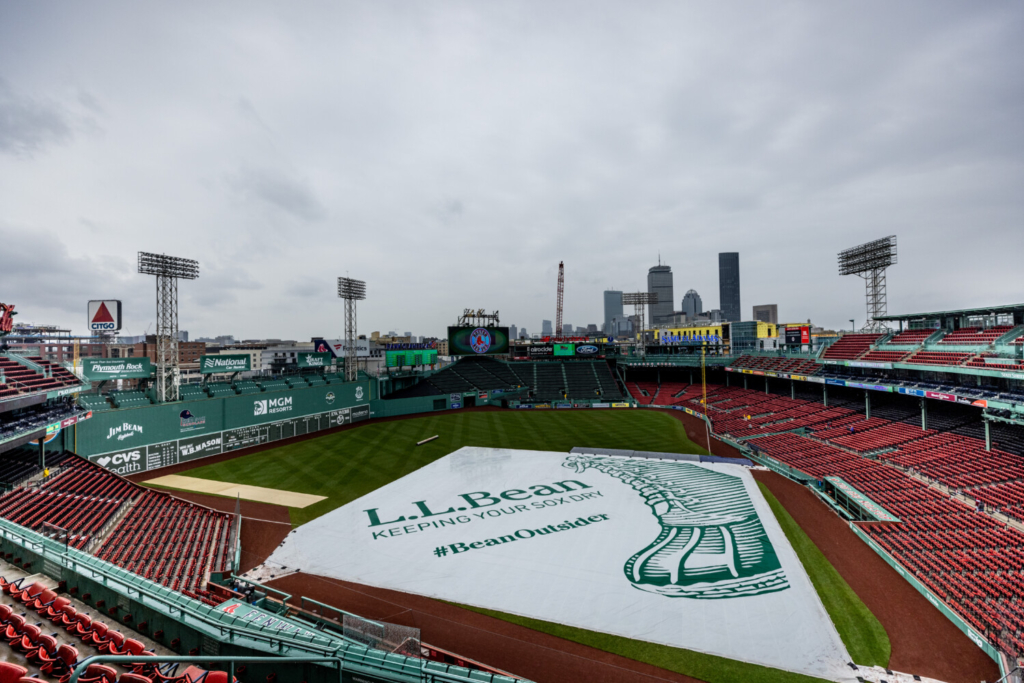 Red Sox fans take advantage of flooded Fenway Park during rain