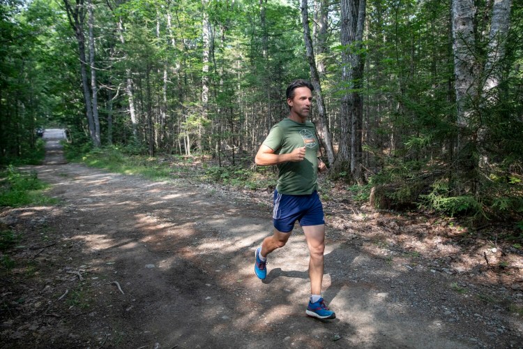 Jason Bigonia, shown running the trail loop through Dodge Point Preserve in Newcastle in July. Bigonia is an ultramarathon runner who qualified to compete in the world championship of backyard ultras this fall.