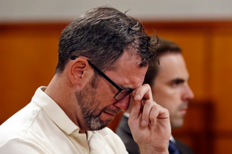 Robert Clarke of Braintree, Massachusetts, who pleaded guilty to aggravated assault during a hearing Tuesday in Cumberland County Superior Court, cries during statements by the victim's family. 