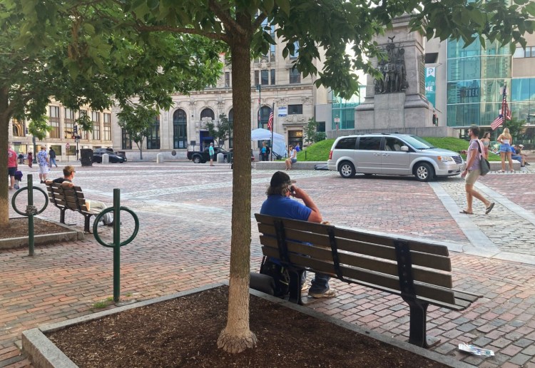 PORTLAND, ME - AUGUST 6: Portland officials reinstalled three park benches to their original locations in Monument Square, after being called out by homeless advocates. Two are shown here Friday evening.  (Staff photo by Michele McDonald/Staff Photographer)