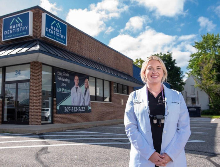Dr. Katie Clark poses for a photo on Tuesday at Maine Dentistry in Auburn. The practice opened its third Maine location last week in Auburn on Center Street with six staff and two dentists.