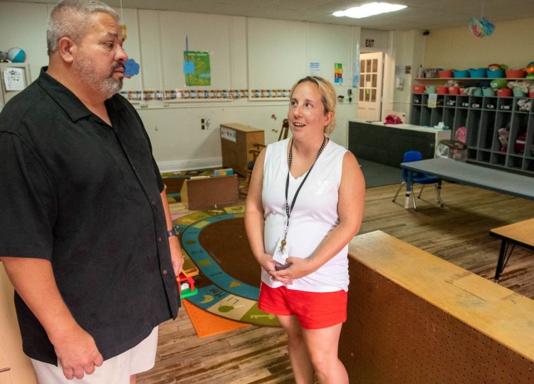 Steve Wallace, CEO of the YMCA of Auburn-Lewiston in Auburn, talks to Susan Remalia, the assistant director of childhood education, on Thursday in one of the classrooms at the Y.