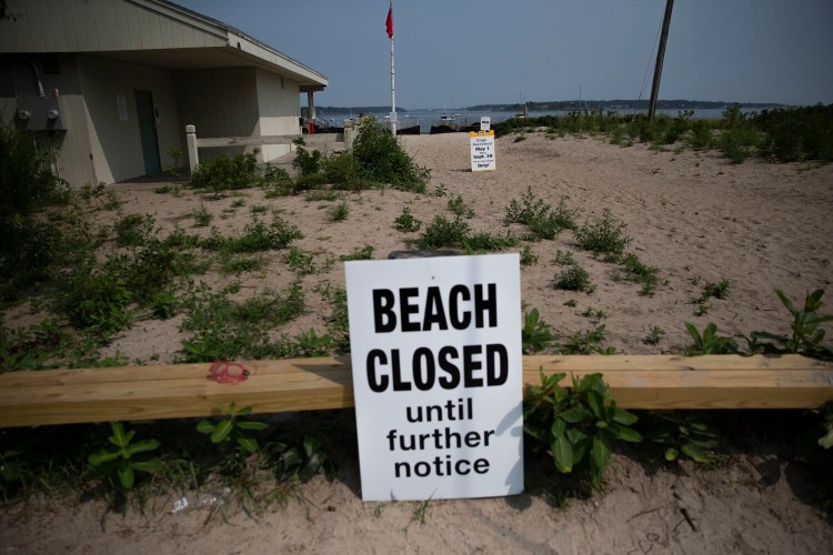 Willard Beach in South Portland remained  closed on Thursday because oil was discharged from a storm drain pipe.