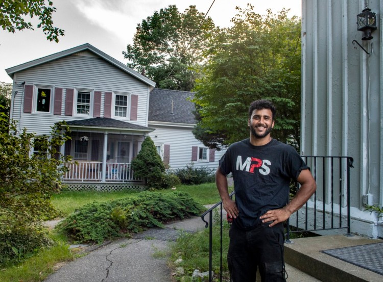 Hussein Albraihi stands in the Capital Area New Mainers Project's small complex Thursday in Hallowell.