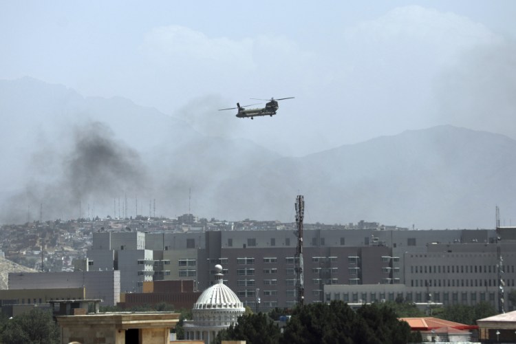 A U.S. Chinook helicopter flies over the city of Kabul, Afghanistan, on Sunday.