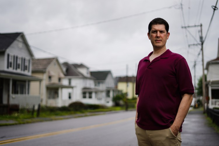 Rental property owner Ryan David poses for a photograph in Pittston, Pa., Wednesday. David fears the $2,000 he's owed in back rent will quickly climb to thousands more as a result of the Centers for Disease Control and Prevention announcing a new moratorium, lasting until Oct. 3.