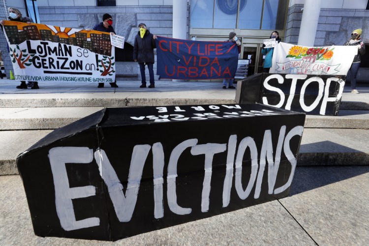 Tenants' rights advocates demonstrate in front of the Edward W. Brooke Courthouse in Boston in January. A federal judge is refusing landlords' request to put the Biden administration’s new eviction moratorium on hold, though she made clear she thinks it's illegal. 