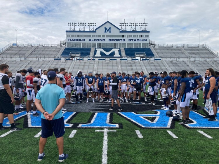 University of Maine head coach Nick Charlton speaks to his football team after its final preseason scrimmage Wednesday at Alfond Stadium in Orono.