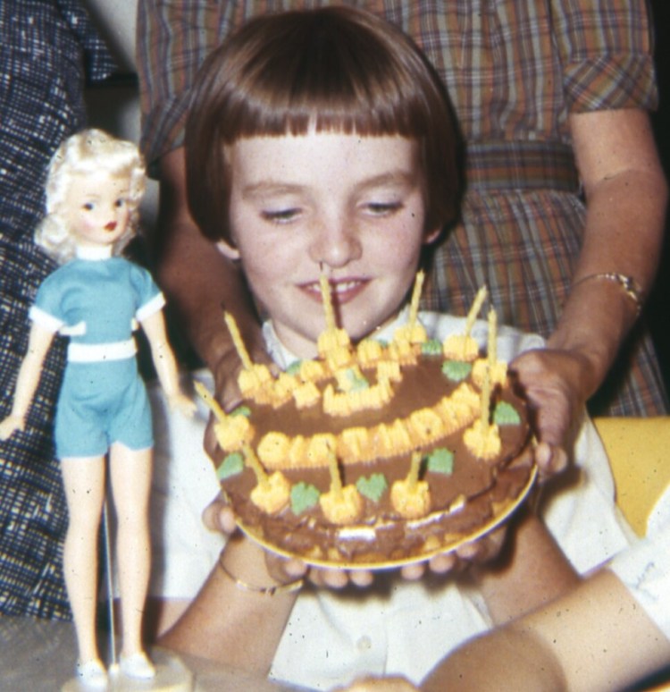 Writer Monica Wood on her 10th birthday, with Tammy doll and her mum's "splendid chocolate cake."